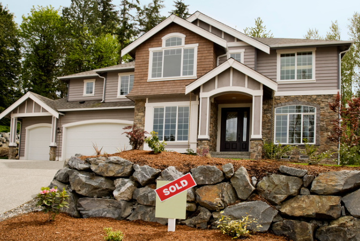 Home with SOLD sign